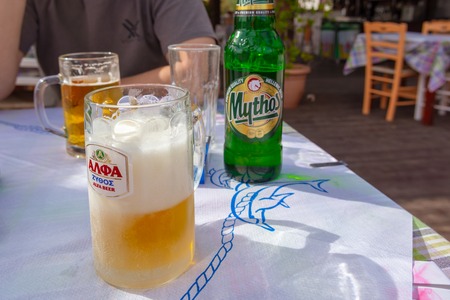 CRETE, GREECE - May 2, 2015: Mug with beer in traditional Greek tavern, Crete, Greeceのeditorial素材