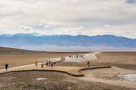 DEATH VALLEY, CALIFORNIA, USA - April 4, 2019: People visit the Saltsee and Badwater basin. At 282 feet below sea level, Badwater Basin is the lowest point in the USA.のeditorial素材