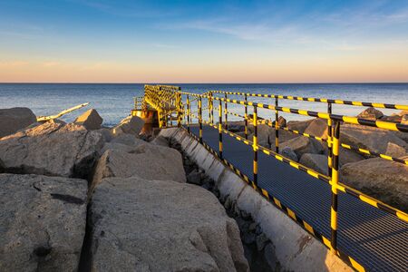 A metal bridge on the North Breakwater overlooking the gulf of Gdansk near the beach at Westerplatte. Gdansk, Polandの写真素材
