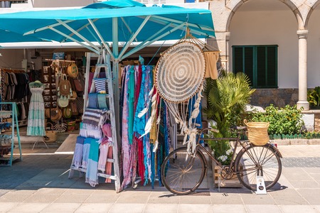 MALLORCA, SPAIN - May 6, 2019: Souvenir stand in the Port de Pollenca (Puerto Pollensa), a popular family resort in the north-west of Mallorca. Spainのeditorial素材