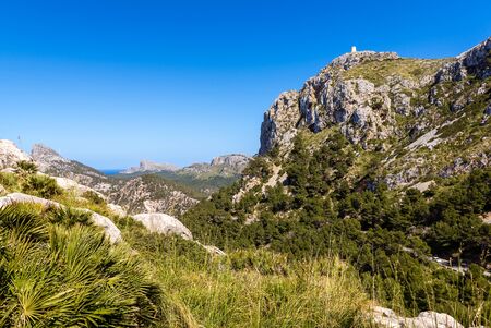 Mountains with tower on the top in north east of Mallorca. Cap de Formentor. Spainの写真素材