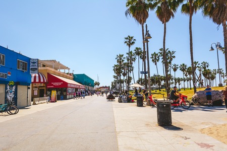 VENICE BEACH, CALIFORNIA, USA - April 10, 2019: Seaside promenade with shops and palm trees on a sunny day in Los Angeles, California, USAのeditorial素材
