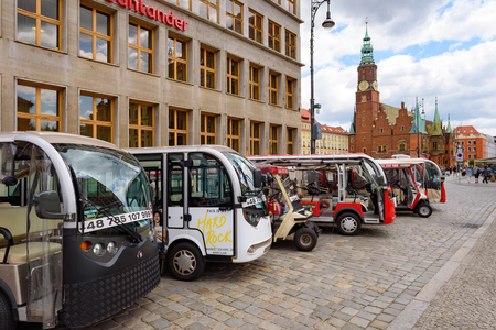 WROCLAW, POLAND - July 17, 2019: Mini buses, friendly eco cars to take a trip on the Market Square in Wroclawのeditorial素材