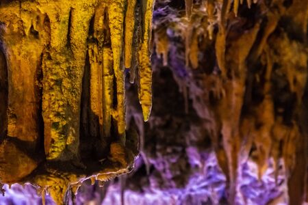 Formations of stalactites and stalagmites in a caveの写真素材