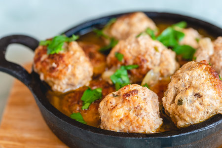 Homemade pork and beef meatballs in gravyの写真素材