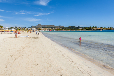 Mallorca, Spain - May 11, 2019: Umbrellas and sunbeds at the Playa de Alcudia beach in northern Mallorca, Spainのeditorial素材