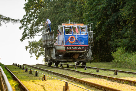 Buczyniec, Poland - August 24, 2019: Sailing on the grass - tourist cruises on the Elblag Canal.