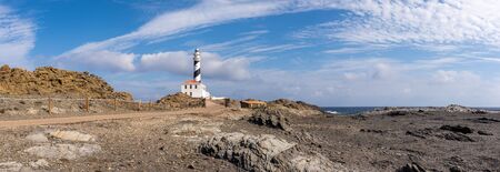 Favaritx lighthouse at the extreme north-east of the island of Menorca in Spainの写真素材