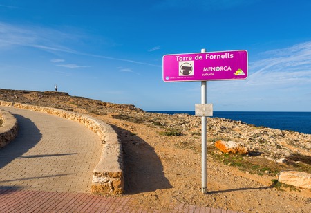 Menorca, Spain - October 12, 2019: Path to Torre de Fornells, coastal defense tower to guard the entrance to Fornells harbour. Menorca, Spainのeditorial素材