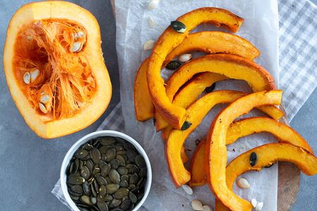 Roasted pumpkin slices with pumpkin seeds.の写真素材