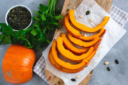 Roasted pumpkin slices with pumpkin seeds.の写真素材