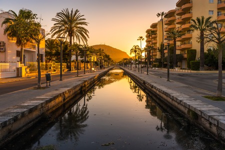 ALCUDIA, MALLORCA - May 5, 2019: A canal in the city of Alcudia on Mallorcaのeditorial素材