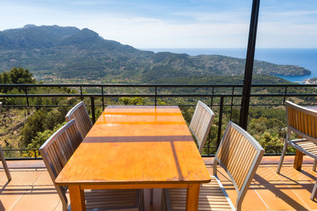 Empty tables overlooking the bay of Port de Soller on the west coast of Majorca. Spain
