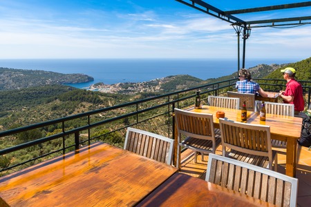 Mallorca, Spain: May 7, 2019: Tables in restaurant overlooking the bay of Port de Soller on the west coast of Majorca. Spainのeditorial素材