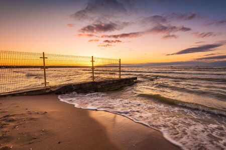 Sandy beach of the Baltic Sea at sunset light. Poland.の写真素材