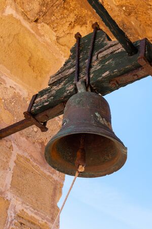 Mallorca, Spain - May 10, 2019: Bell in Capdepera Castle, fortress from the 14th century, located on the east coast of Majorcaのeditorial素材