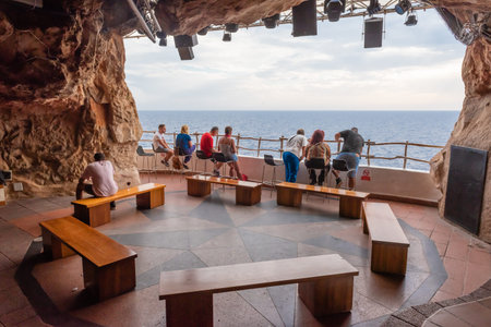 Menorca, Spain - October 14, 2019: Interior of cafe bar Cova dâ€™en Xoroi in the caves on the...