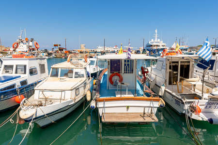 Rhodes, Greece - May 13, 2018: Boats for fishing cruises in Mandraki port of Rhodes.のeditorial素材