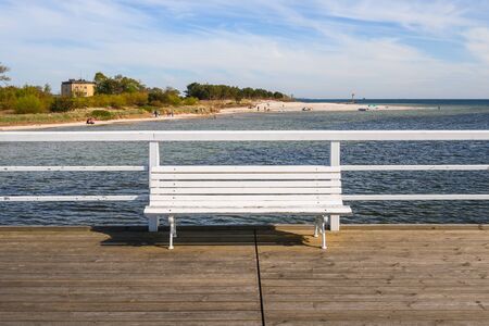 Jastarnia, Poland - May 09, 2020: Bench on the pier in Jastarnia, a very popular tourist destination in northern Poland.の写真素材