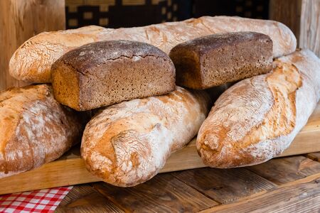 Homemade loaves of rye and wheat breadの写真素材