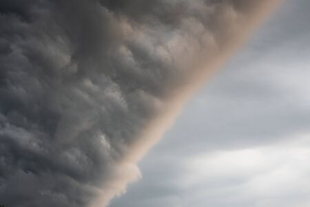 Dark and stormy clouds, natural background, textureの写真素材