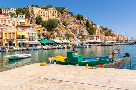 SYMI, GREECE - May 15, 2018: Beautiful Symi island with colorful architecture and beautiful bay,...