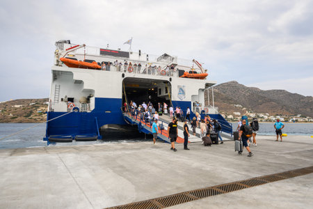 Ios, Greece - September 19, 2020 - Tourists disembark from ferry ship on Ios Island. Cyclades,...