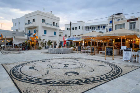 Ios, Greece - September 19, 2020: Main square with restaurants and taverns in the port of Ios island. Cyclades, Greeceのeditorial素材