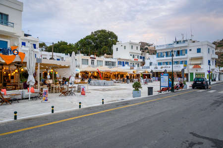 Ios, Greece - September 19, 2020: Street with restaurant and shops in the port of Ios island. Cyclades, Greeceのeditorial素材