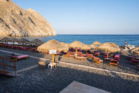 Santorini, Greece - September 16, 2020: Black Beach with volcanic sand in Perissa, a tourist resort in Santorini. Cyclades, Greeceのeditorial素材