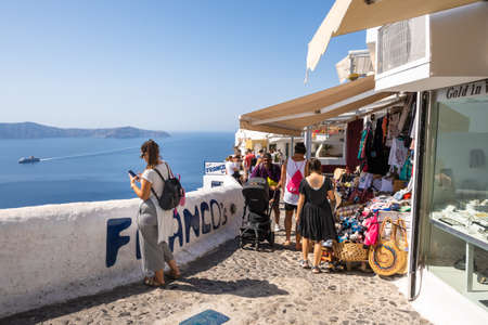 Santorini Greece, September 17, 2020: Seafront promenade in Fira, a largest town in Santorini with lots of restaurants and shopping. Cyclades Islands, Greeceのeditorial素材