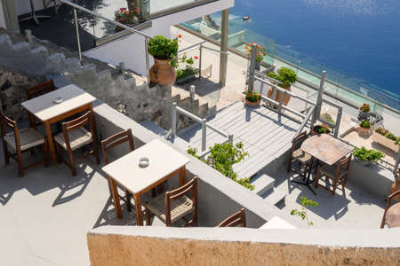 Santorini Greece, September 17, 2020: Greek seafront restaurant in Fira on Santorini Island. Cyclades, Greeceのeditorial素材