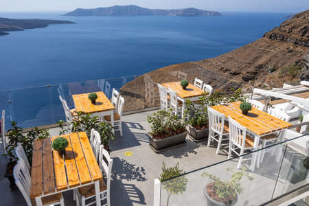Santorini Greece, September 17, 2020: Greek seafront restaurant in Fira on Santorini Island. Cyclades, Greeceのeditorial素材