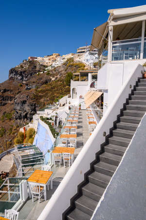 Santorini Greece, September 17, 2020: Greek seafront restaurant in Fira on Santorini Island. Cyclades, Greeceのeditorial素材