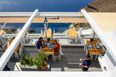 Santorini Greece, September 17, 2020: Greek seafront restaurant in Fira on Santorini Island. Cyclades, Greeceのeditorial素材