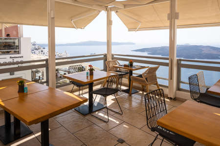 Santorini Greece, September 17, 2020: Greek seafront restaurant in Fira on Santorini Island. Cyclades, Greeceのeditorial素材