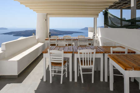 Santorini Greece, September 17, 2020: Greek seafront restaurant in Fira on Santorini Island. Cyclades, Greeceのeditorial素材