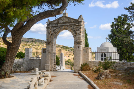 Paros, Greece - September 27, 2020: Entrance gate to the Greek graveyard in Lefkes on Paros Island.のeditorial素材