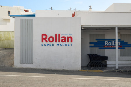 Ios, Greece - September 20, 2020: Supermarket Rollan at main square of Chora, Ios island. Cyclades, Greece.のeditorial素材