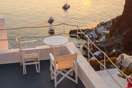 Santorini, Greece - September 17, 2020: Terrace overlooking the sea and the sunset in Oia village in Santoriniのeditorial素材