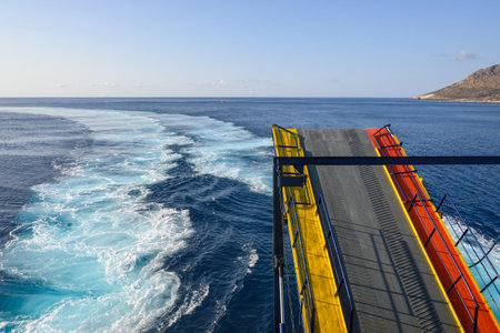 Wake in the Aegean Sea made by large ferry. Sunny summer day.