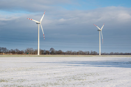 Wind farm for electric power production. Winter landscape in northern Poland. Europe