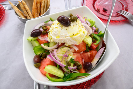 Traditional Greek salad with vegetables and local cheese served on Folegandros Island, Greeceの写真素材