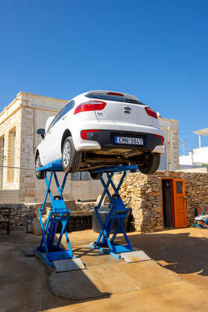 Folegandros, Greece - September 25, 2020: Kia Rio car on a lift during an inspection in a car workshop. Folegandros island, Greeceのeditorial素材
