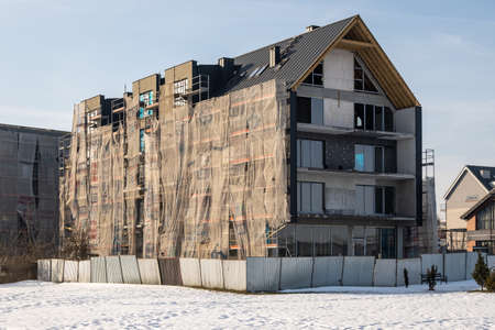Tczew, Poland - February 21, 2021: Modern building under construction right on the Vistula River in Tczewのeditorial素材