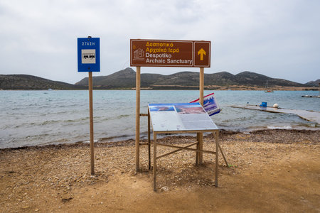 Antiparos, Greece - September 28, 2021: Despotiko information board. Archaeological excavations at the Sanctuary of Apollo on Despotiko, an uninhabited island in the Cyclades. Greeceのeditorial素材