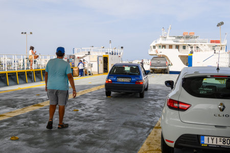 Paros, Greece - September 28, 2020: Cars leave the ferry on the island of Paros during the summer season. Cyclades, Greeceのeditorial素材
