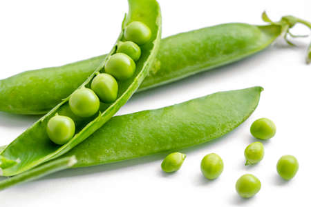 Fresh green peas on a white backgroundの写真素材