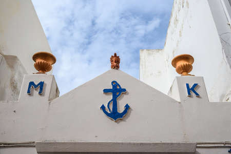 Paros, Greece - September 28, 2020: Details of white facade of Greek house in Parikia town on paros island. Cyclades, Greeceのeditorial素材