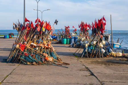 Krynica Morska, Poland - May 15, 2021: Fishing red flags in port of Krynica Morska located on the Vistula Spit between lagoon and Baltic Sea in Polandのeditorial素材